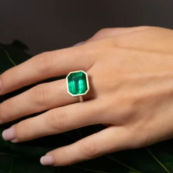 Shop BEZELED EMERALD CUT EMERALD RING WITH DIAMOND BASKET AND BAND One Of A Kind